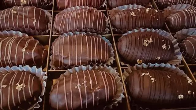 Chocolate covered Medjoul dates arranged in a gifting box